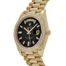 Rolex Day-Date 40 228398TBR Yellow Gold Onyx Baguette Diamond Dial Baguette Bezel